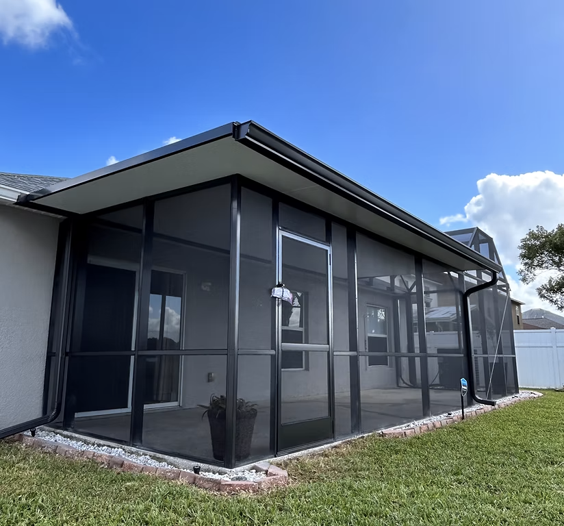 Lanai screen enclosure installation in Palm Coast, FL on residential backyard patio