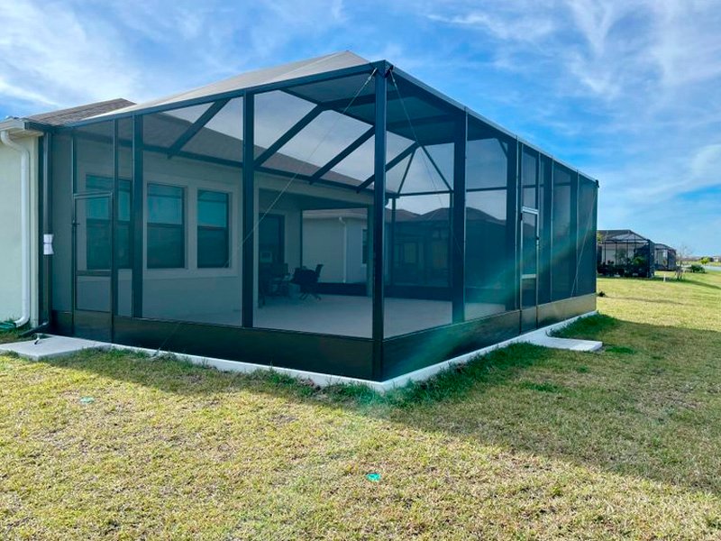 Screened lanai enclosure installation in Palm Coast, FL on residential backyard lanai